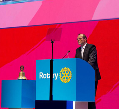 Rotary club convention man speaking on stage
