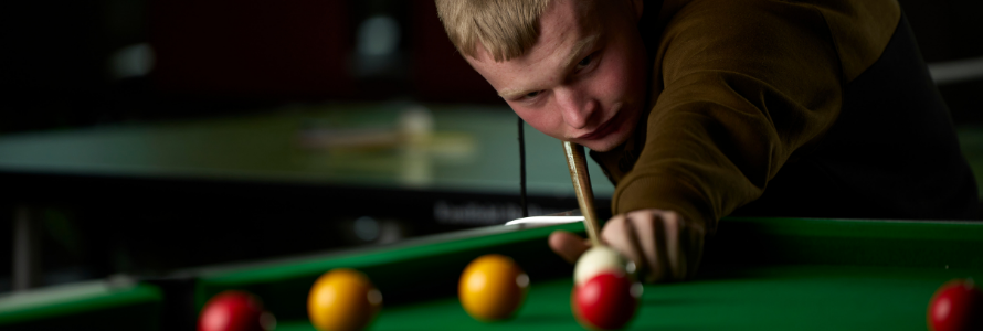 LCB student playing pool